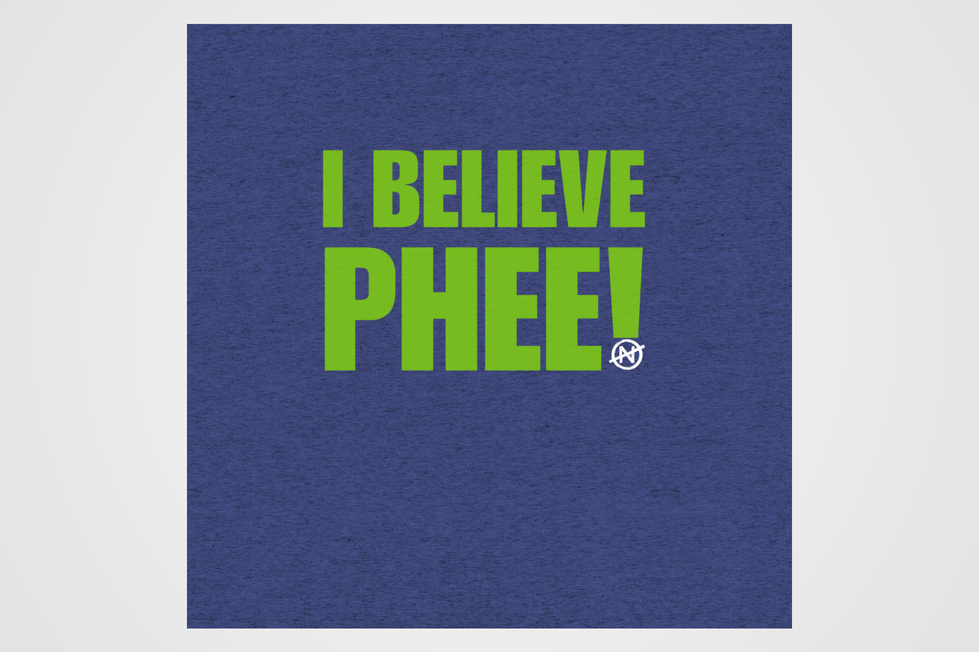 A heather blue detail image of front green text statement “I BELIEVE PHEE!” centered on the front. The shirt represents solidarity with WNBA player Napheesa Collier and women athletes speaking truth to power. Designed by No Assumptions Apparel, it stands for gender equity, justice, and accountability in women’s sports. The minimalist design makes a strong visual statement about believing women, amplifying voices, and calling for fairness and reform within the WNBA and beyond.