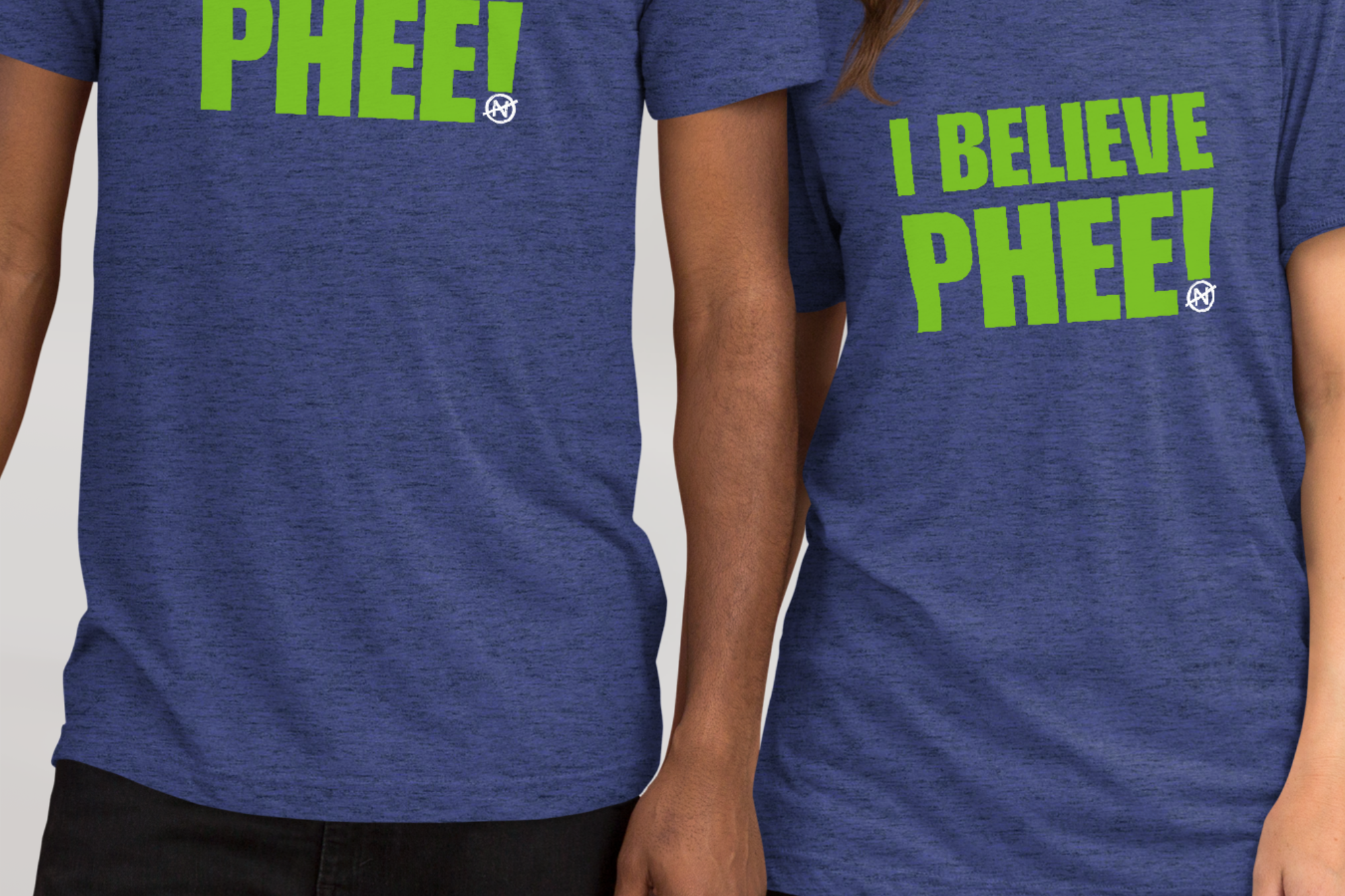 Two models with heather blue unisex tee with lynx green text featuring the bold statement “I BELIEVE PHEE!” centered on the front. The shirt represents solidarity with WNBA player Napheesa Collier and women athletes speaking truth to power. Designed by No Assumptions Apparel, it stands for gender equity, justice, and accountability in women’s sports. The minimalist design makes a strong visual statement about believing women, amplifying voices, and calling for fairness and reform within the WNBA and beyond.