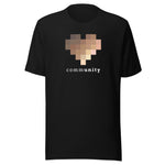 A solid black unisex, crew-neck t-shirt in solid black.  The central graphic on the chest is a large pixelated heart composed of blurred squares in varying skin-tone shades. Below the heart, the word "community" is printed in lowercase letters. The font alternates between bold and light weights, highlighting the letters "unity."