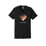 A solid black unisex, V-neck t-shirt in solid black.  The central graphic on the chest is a large pixelated heart composed of blurred squares in varying skin-tone shades. Below the heart, the word "community" is printed in lowercase letters. The font alternates between bold and light weights, highlighting the letters "unity."