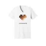 A white unisex, V-neck t-shirt in solid black.  The central graphic on the chest is a large pixelated heart composed of blurred squares in varying skin-tone shades. Below the heart, the word "community" is printed in lowercase letters. The font alternates between bold and light weights, highlighting the letters "unity."