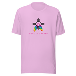 A lilac crew neck unisex t-shirt featuring a design centered around the Zia symbol, representing the sun with four rays. 

At the symbols center, begins two colorful PRIDE rainbow feathers, hanging over the symbol creating a love and spirituality vibrancy accent.

Below the design, "LOVE IS SACRED" text displayed in pink bold lettering.