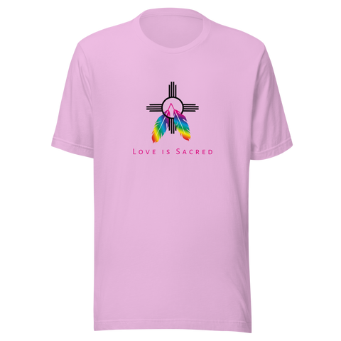 A lilac crew neck unisex t-shirt featuring a design centered around the Zia symbol, representing the sun with four rays. 

At the symbols center, begins two colorful PRIDE rainbow feathers, hanging over the symbol creating a love and spirituality vibrancy accent.

Below the design, "LOVE IS SACRED" text displayed in pink bold lettering.