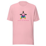 A pink crew neck unisex t-shirt featuring a design centered around the Zia symbol, representing the sun with four rays. 

At the symbols center, begins two colorful PRIDE rainbow feathers, hanging over the symbol creating a love and spirituality vibrancy accent.

Below the design, "LOVE IS SACRED" text displayed in pink bold lettering.