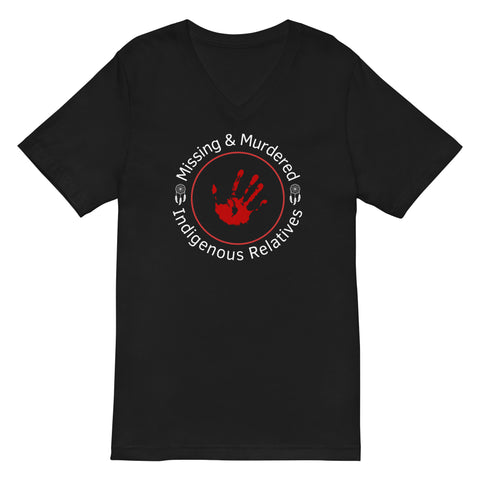 This is a black, V-neck, short-sleeve, unisex-style t-shirt designed to raise awareness for Missing and Murdered Indigenous Relatives (MMIR). Centered on the front is a striking circular design with a powerful message and symbolic imagery.