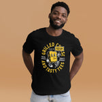Male presenting model in black crew neck tee with Grilled Cheese and Tasty Tees design. His hands are on his back hip with a smile. 