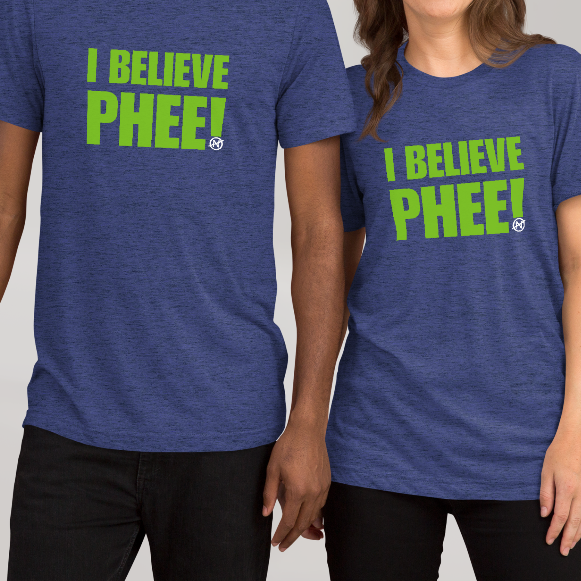 Two models with heather blue unisex tee with lynx green text featuring the bold statement “I BELIEVE PHEE!” centered on the front. The shirt represents solidarity with WNBA player Napheesa Collier and women athletes speaking truth to power. Designed by No Assumptions Apparel, it stands for gender equity, justice, and accountability in women’s sports. The minimalist design makes a strong visual statement about believing women, amplifying voices, and calling for fairness and reform within the WNBA and beyond.