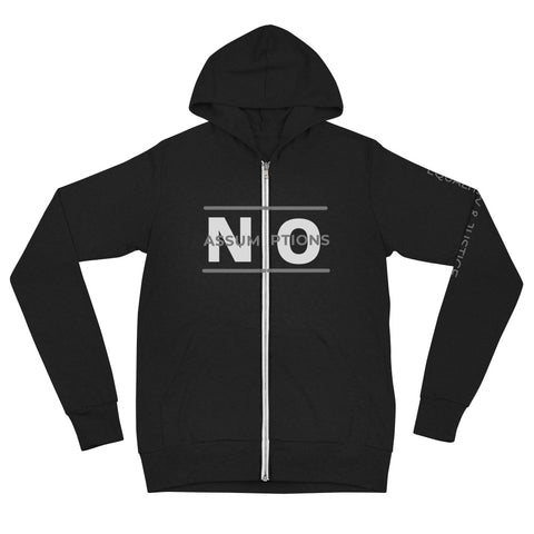 Across the chest, the phrase "NO ASSUMPTIONS" is prominently displayed in large, bold, white letters. Zipper with a line above and below the text similar to an equal sign. The full-length zipper down the front is a bright metallic silver, creating a striking contrast against the black fabric and dividing the front design cleanly down the middle. Subtle left sleeve design runs vertically along its length with the text “Equality & Justice” with thin white font to complement the main design.